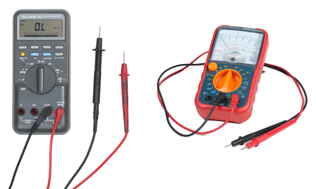 Two different types of multimeters, which are instruments used to measure electrical properties such as voltage, current, and resistance. On the left is a digital multimeter with a black body and a digital screen displaying ‘0.L.’ Below the screen are various buttons and input jacks for the red and black test leads connected to it. On the right is an analog multimeter with a red body and a dial for selecting measurement types; it has an analog scale with a needle pointing to values. The red and black test leads are connected at the bottom.